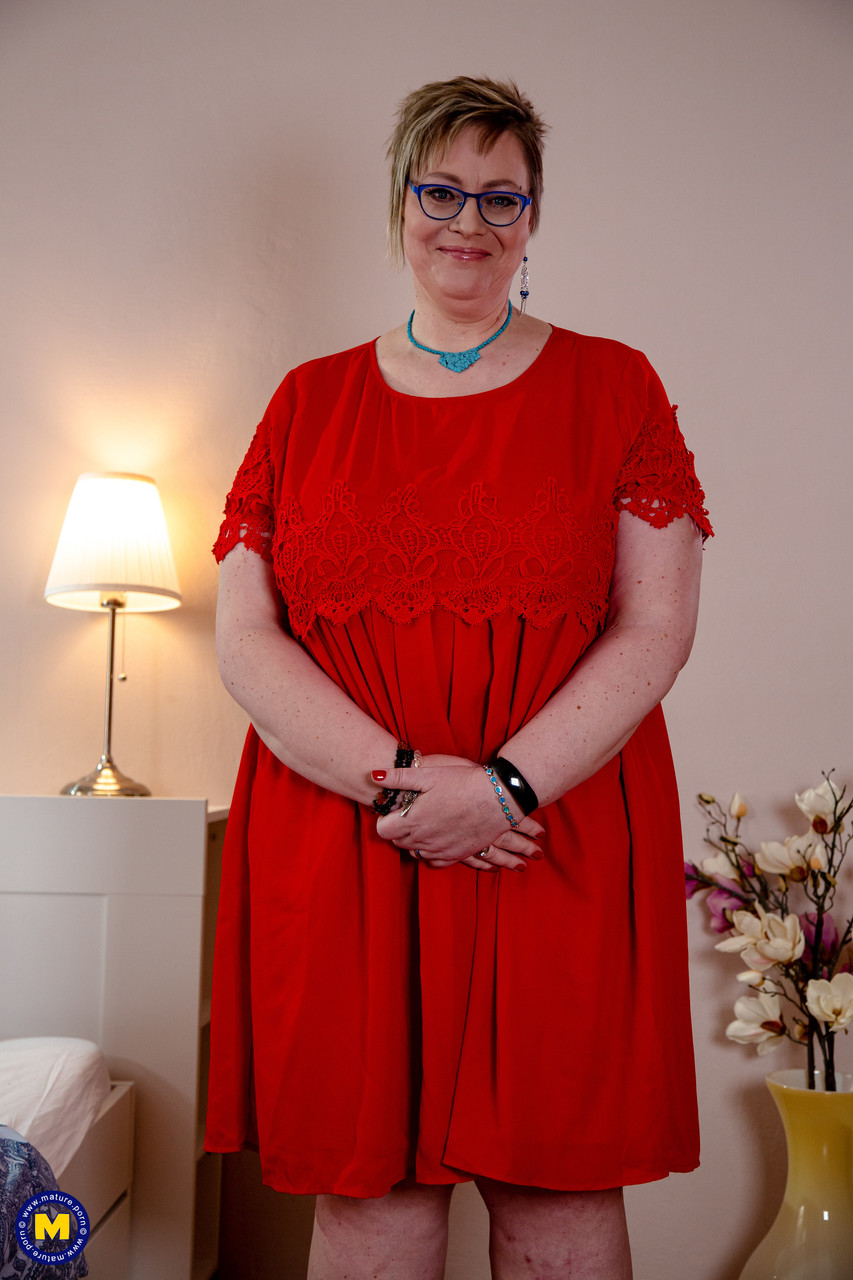 Old fatty in glasses Denisa removes her red dress & lets out her massive juggs