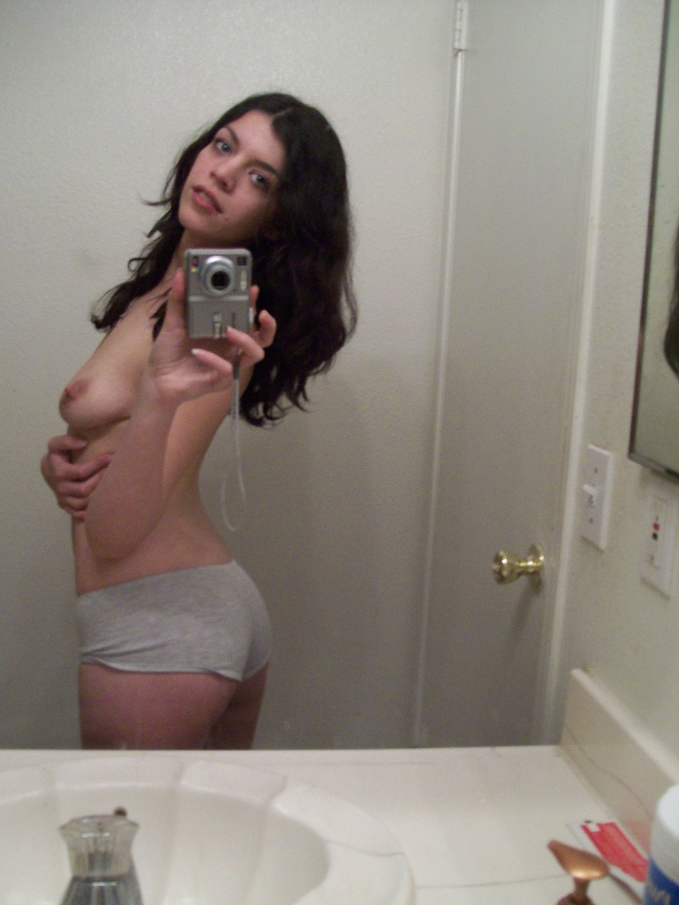 Dark haired teen takes selfies of her nice ass & natural tits in the mirror  