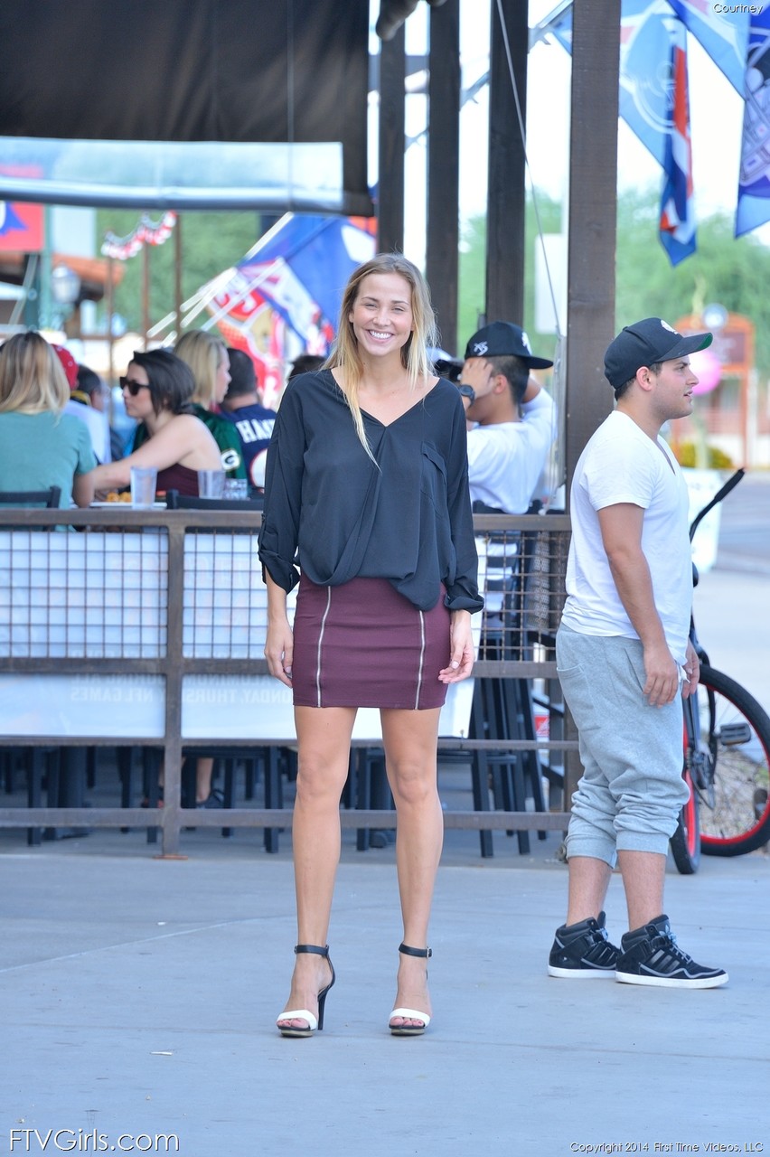 Glamorous blonde in a miniskirt Courtney flaunting her nice tits in public