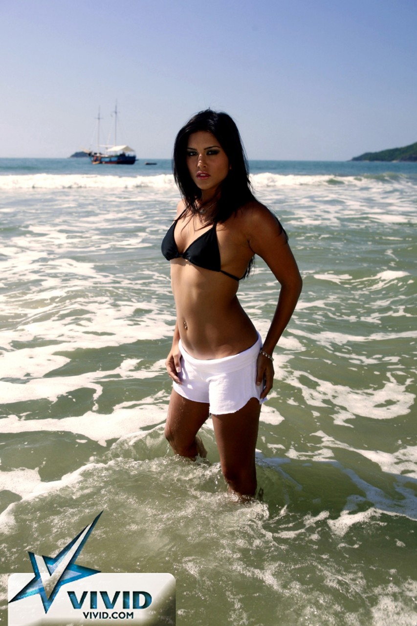 Dark-haired MILF Sunny Leone displaying her hot naked body on the beach  
