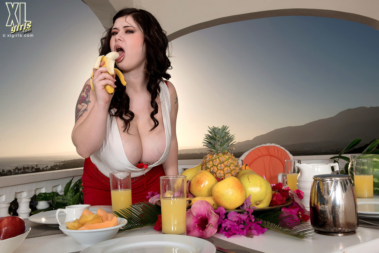 BBW Roxanne Miller eats a banana before unleashing her big naturals