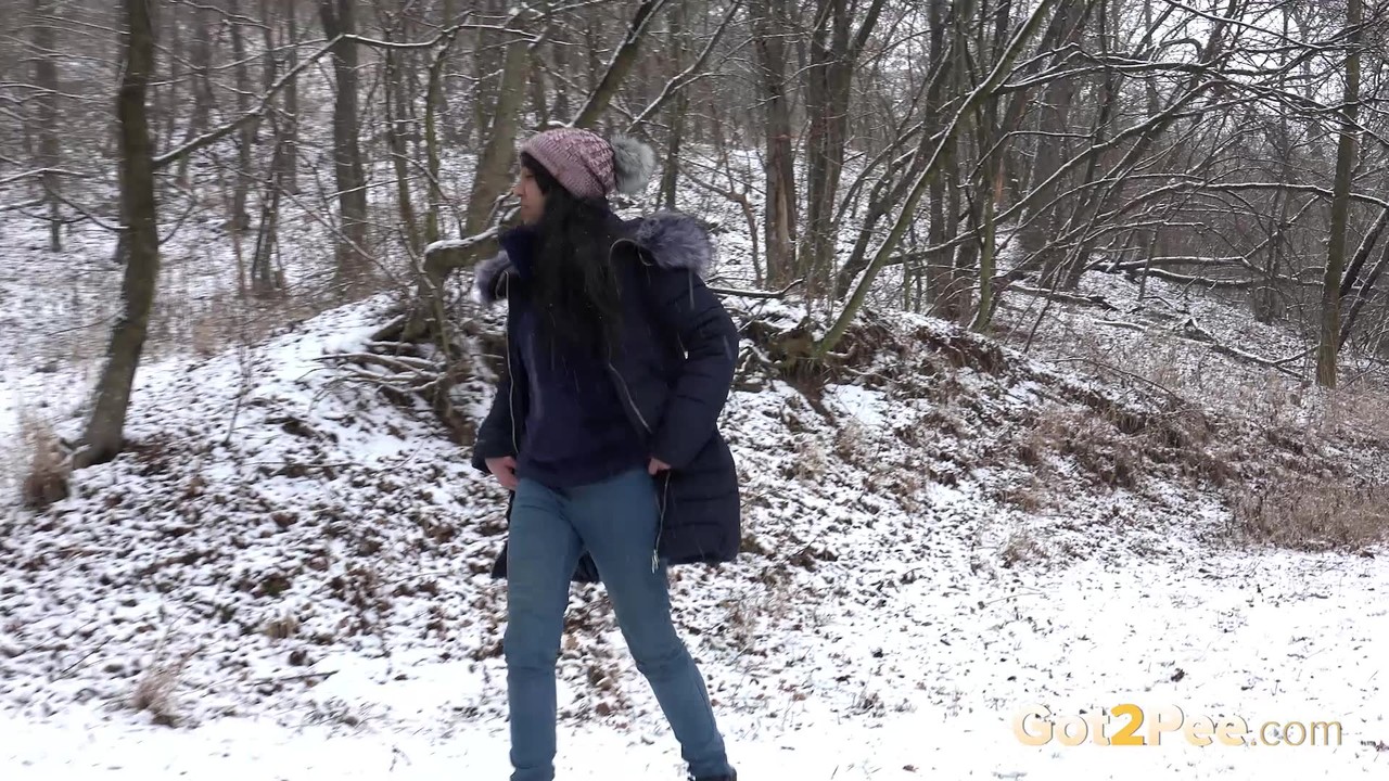 Pretty Eurobabe pees over snow outside  