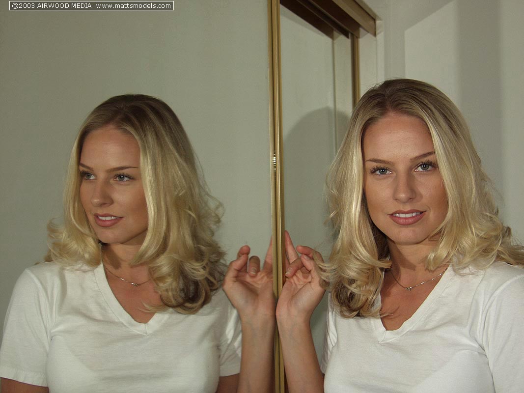 Blonde amateur Jordan West strips naked in front of bedroom mirror  