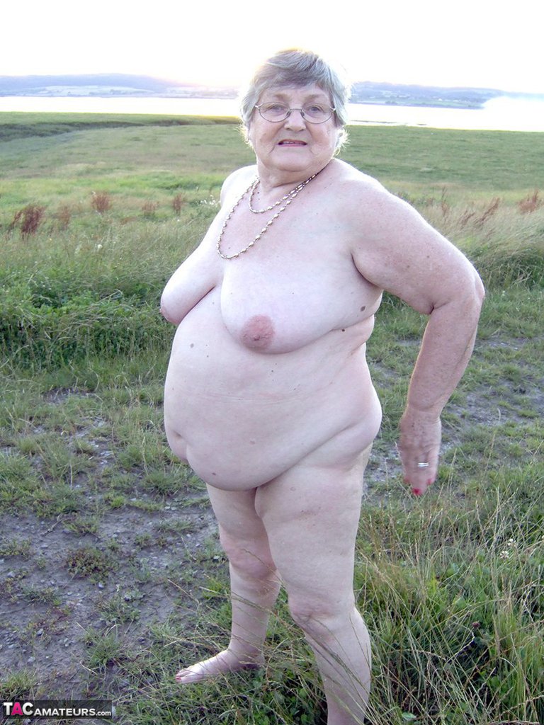 Fat nan Grandma Libby steps into a puddle before covering herself in mud