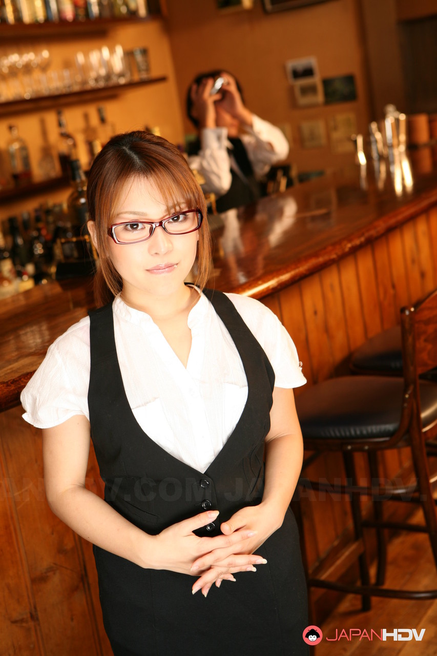 Japanese redhead Aoi Mochida serves a drink before fingering her bush in a bar