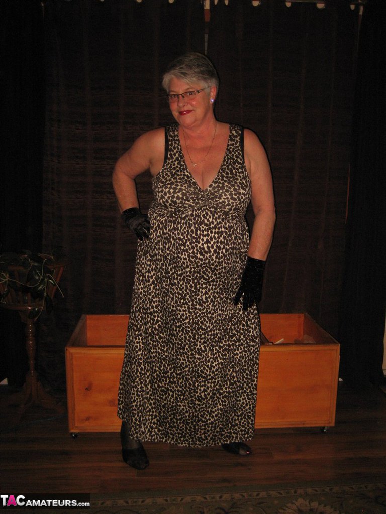 Silver haired granny Girdle Goddess gets naked in stockings and black gloves  
