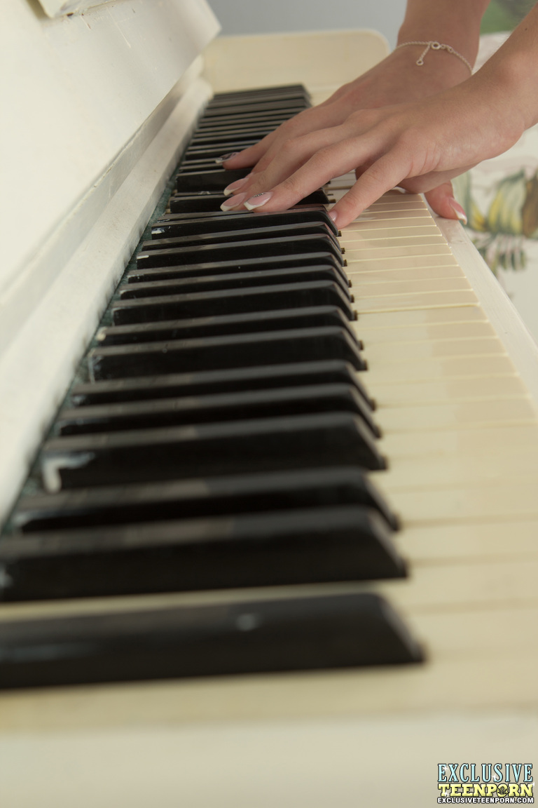 Adorable blonde teen Linet fingers fucks on top of an upright piano
