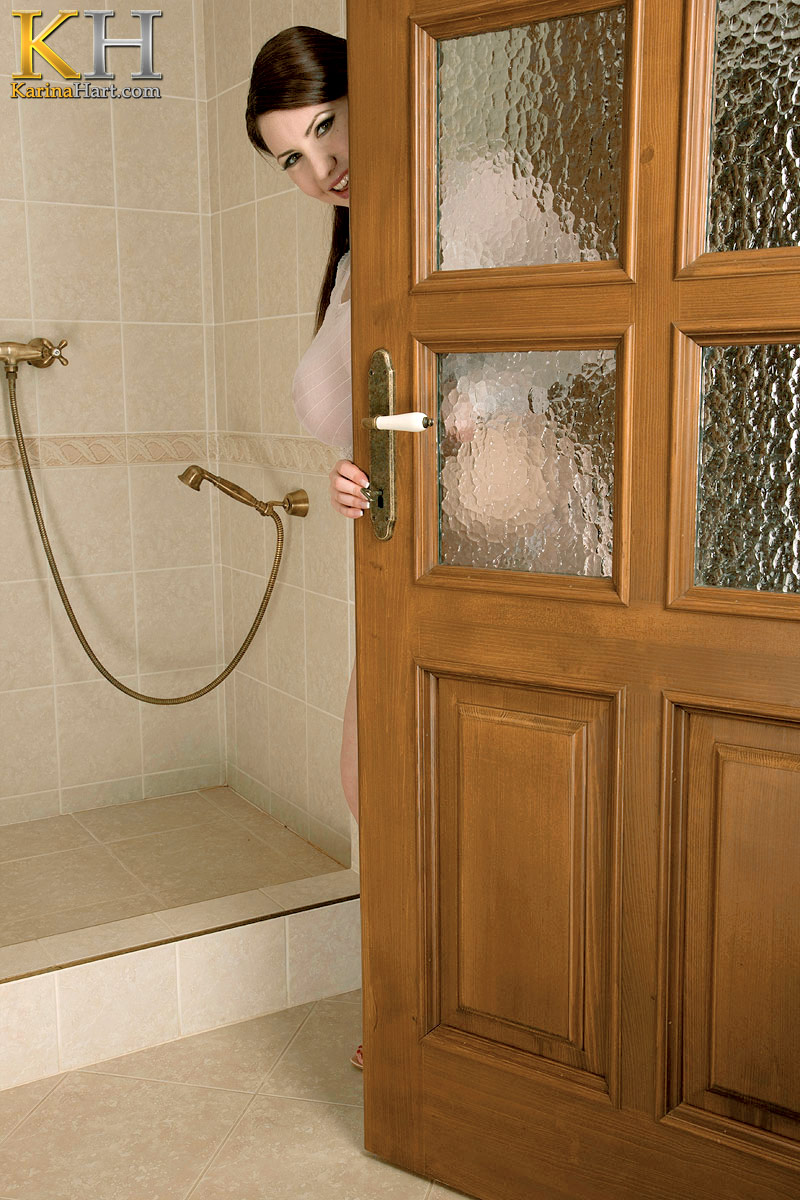 Solo model Karina Hart runs her beautiful big boobs under the shower head  