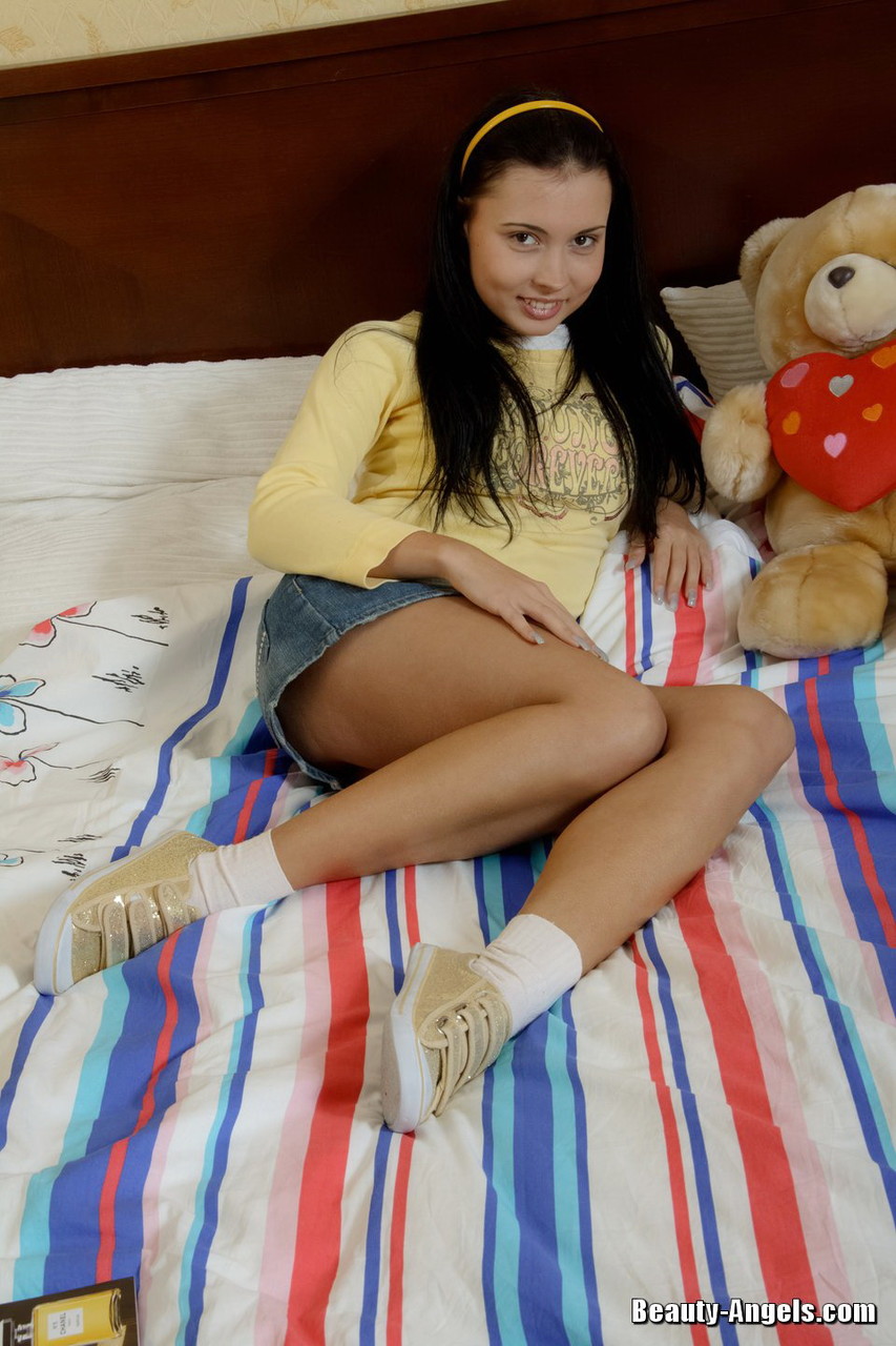Young brunette gets fucked in shoes and socks next to her teddy bear