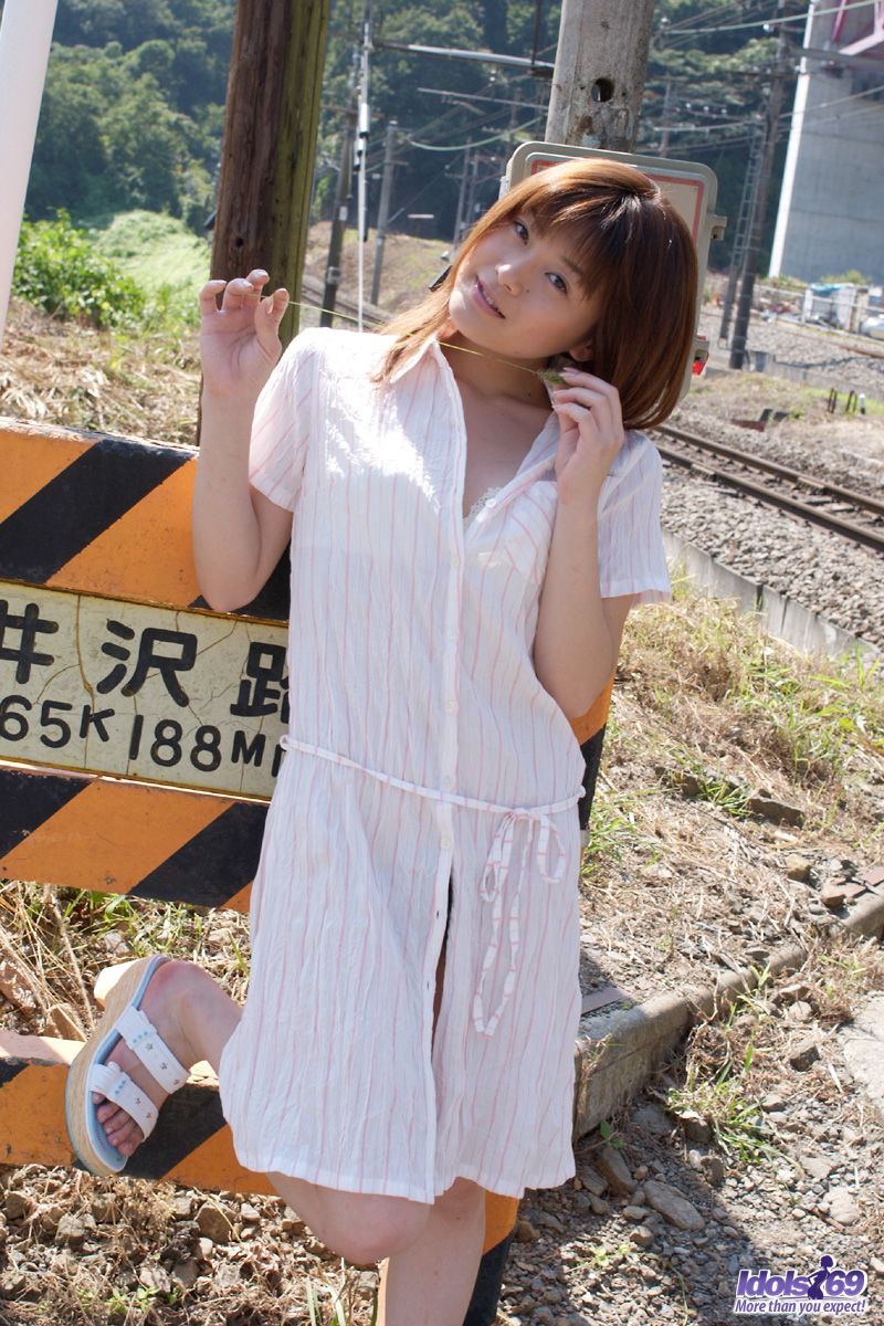 Japanese teen Kyoko Nakajima poses nude on rail tracks and inside her home