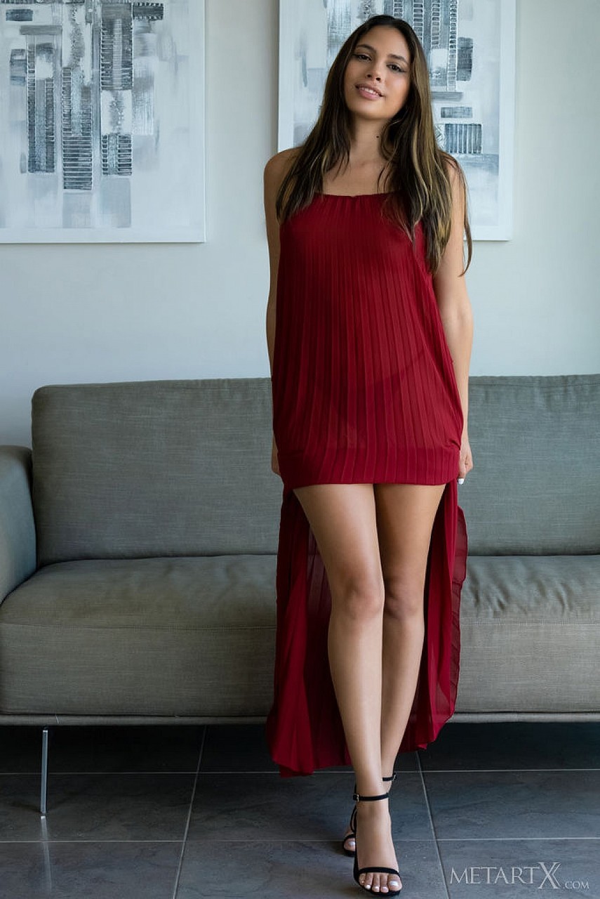 Latina teen Baby Nicols slips off a long red dress