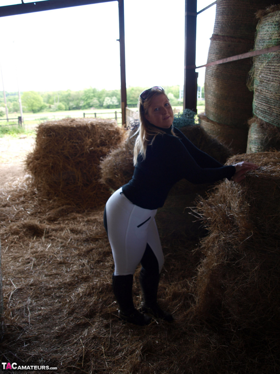 Overweight blonde Samantha exposes herself in a hay room inside of a barn