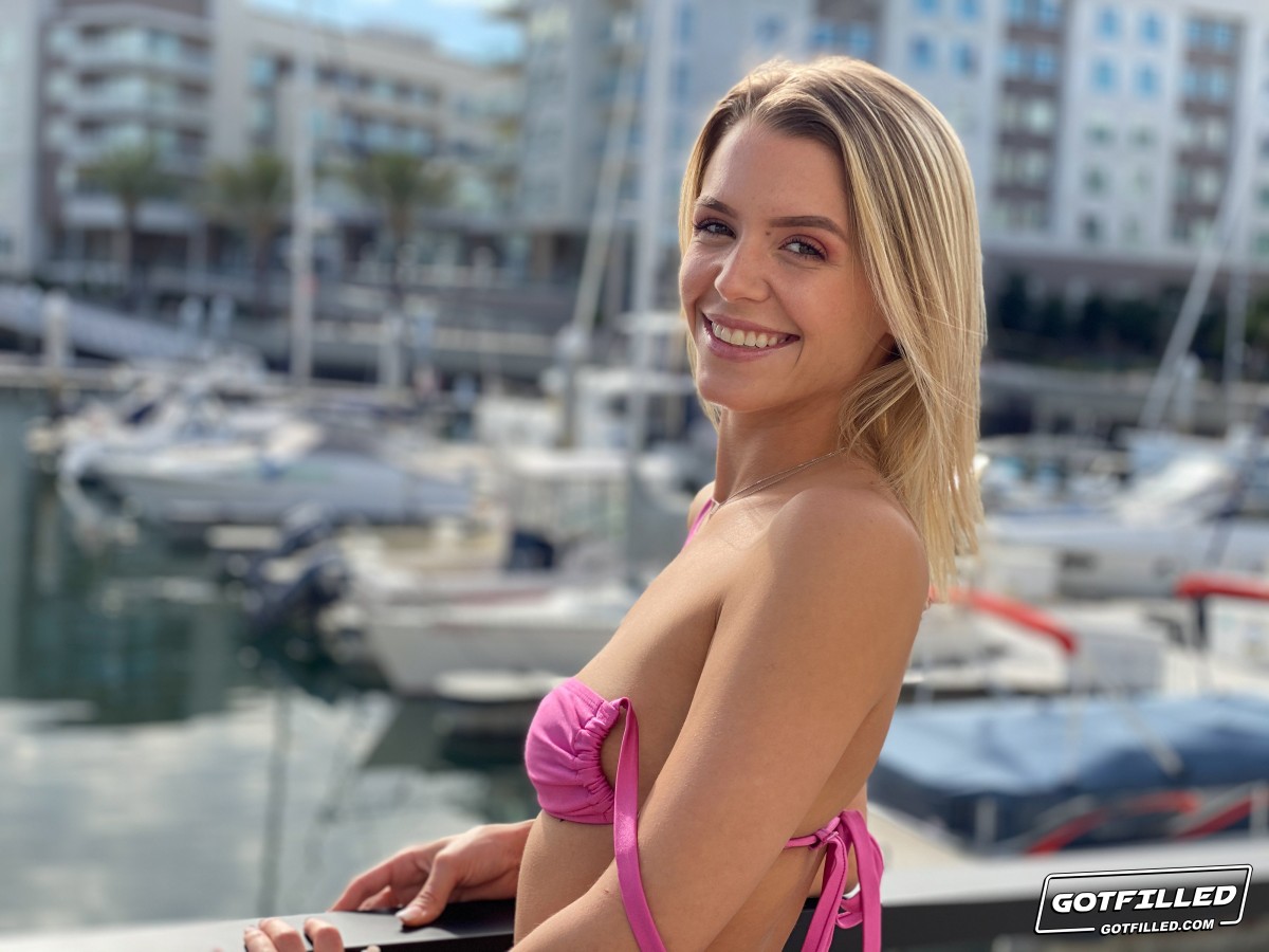 Blond amateur Evelyn Payne models a bikini at a marina before hardcore POV sex  