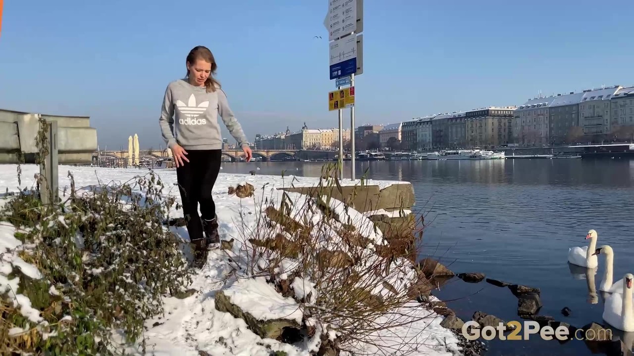 European babe squats next to the river to piss