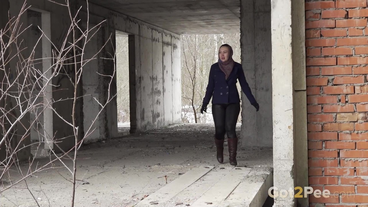Solo girl Anya pulls down her pants for an urgent pee at an abandoned building