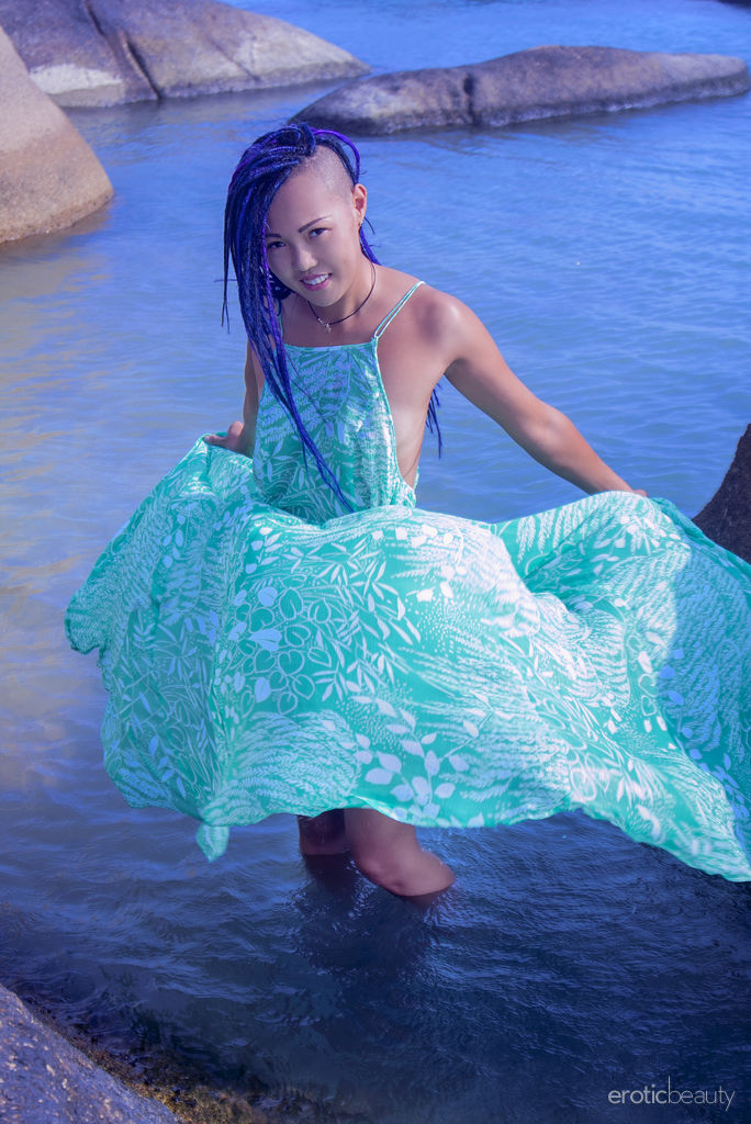 Asian teen Sweet Julie emerges from the ocean to go bare naked