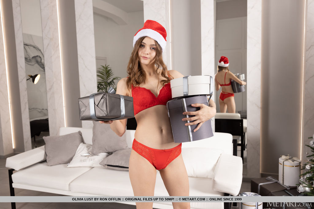 Olivia Lust puts the gifts under the Christrmas Tree and decides to strip off