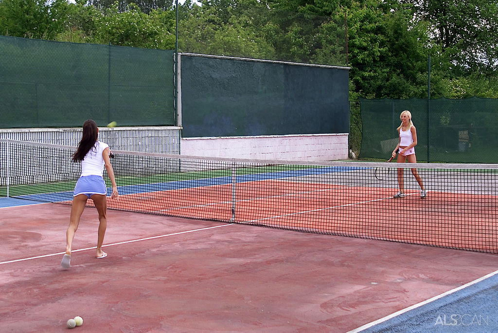 Lesbian girls have sex on a tennis court after stripping during a match