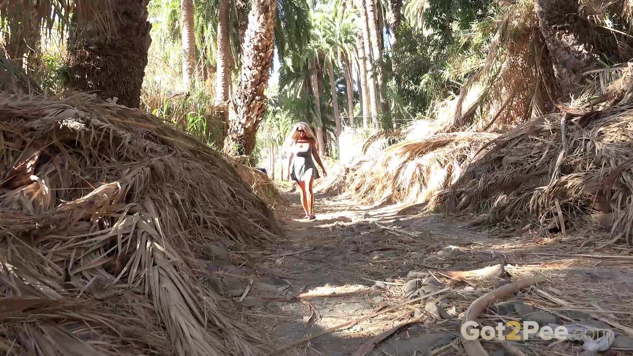 Platinum blonde Chloe gets caught taking a piss during a hike in the