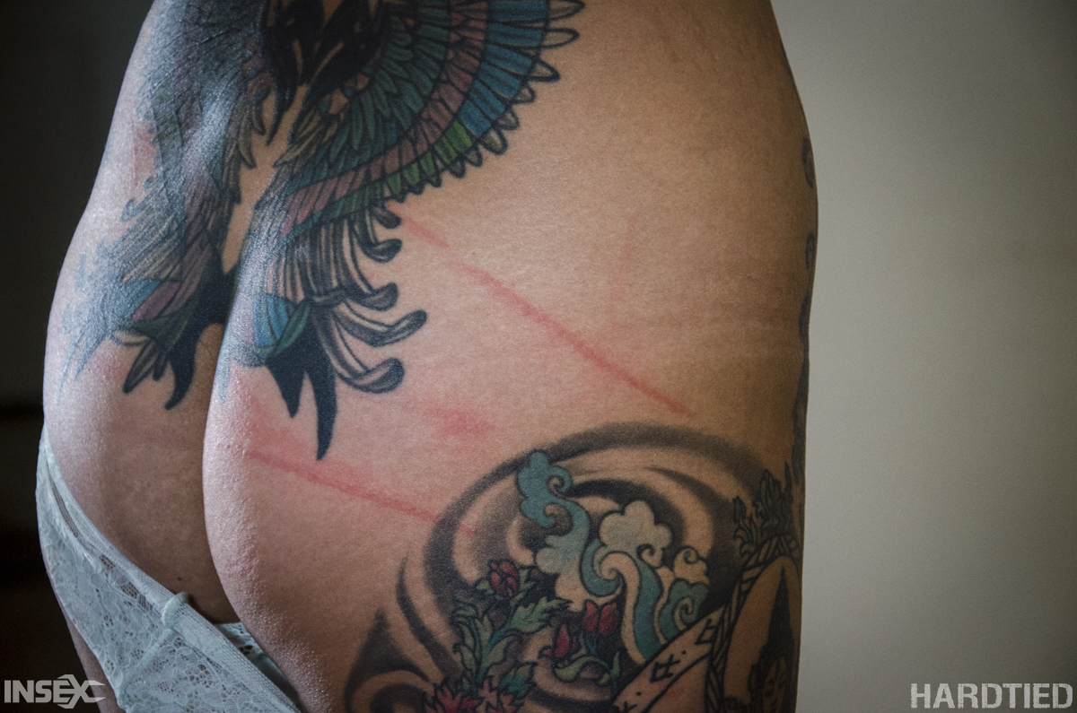 Tattooed Asian girl Chillycarlita struggles against rope bindings  