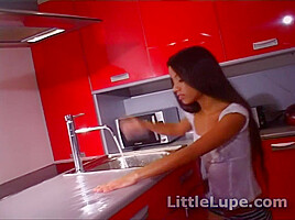 Little Lupe masturbates in the kitchen