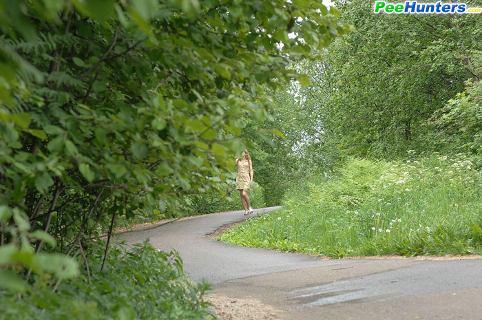 Nude Cutie Tinkles On The Shoulder Of Country Road
