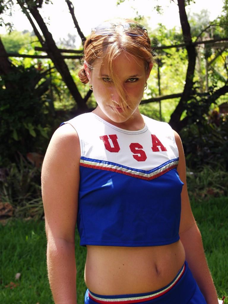 Check Out This Naughty Cheerleader As She Goes Outdoors To P...