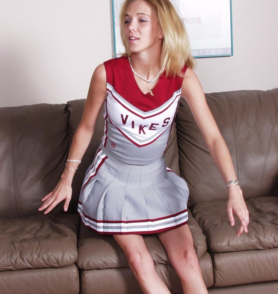 Check Out This Naughty Cheerleader As She Takes Off Her Chee...  