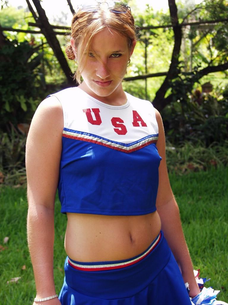 Check Out This Naughty Cheerleader As She Goes Outdoors To Practice And Ends Up Playing W