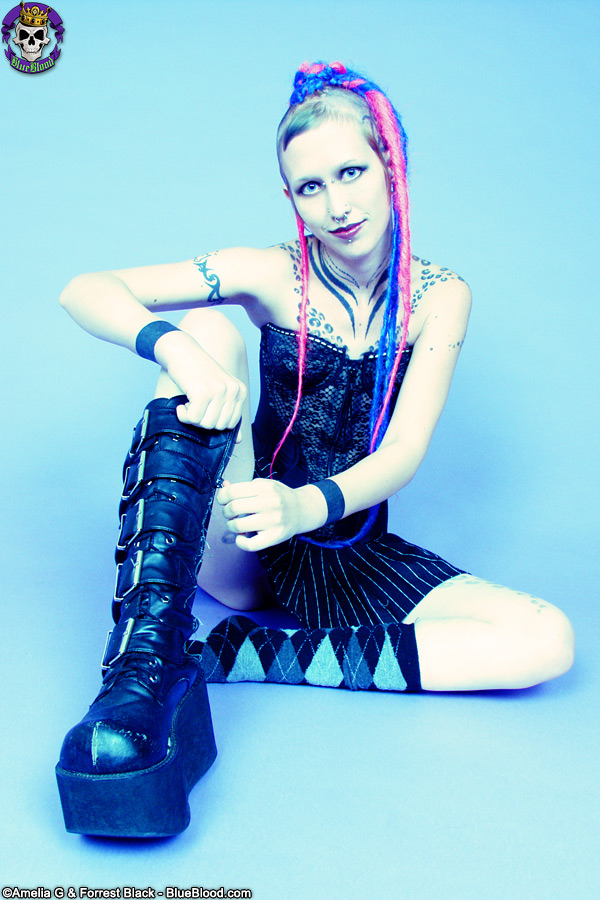 Tattooed Goth-punk Girl In Schoolgirl Skirt