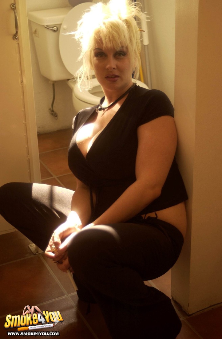 Huge Breasted White Trash Smokes Like Crazy On The Toilet